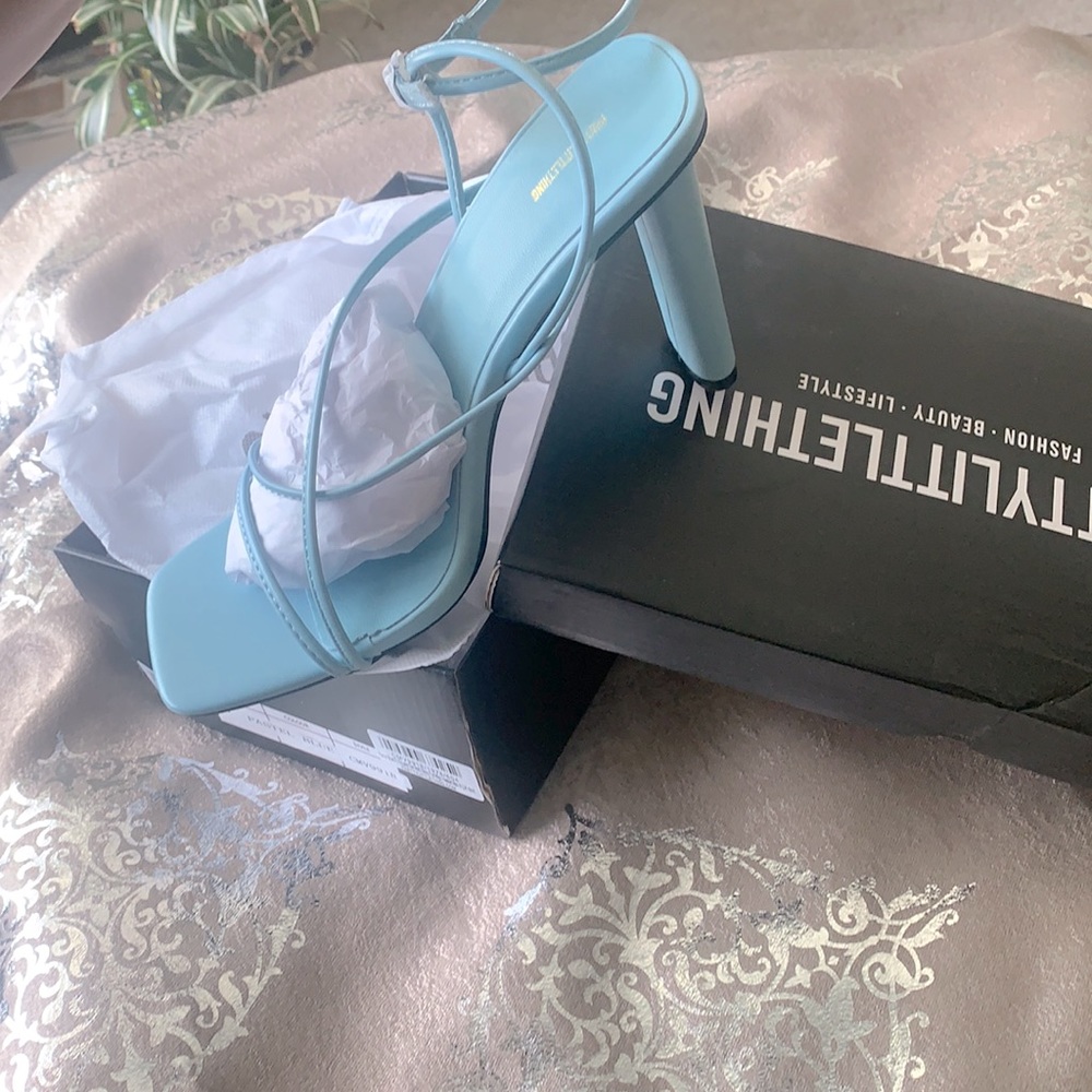 Pastel blue square toe multi strap heels.